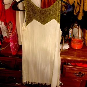 Sleeveless gold tassel blouse. Great New Year’s Eve!great effortless look